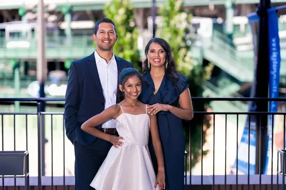 Baby enjoying a colorful smash cake from an Austin bakery
