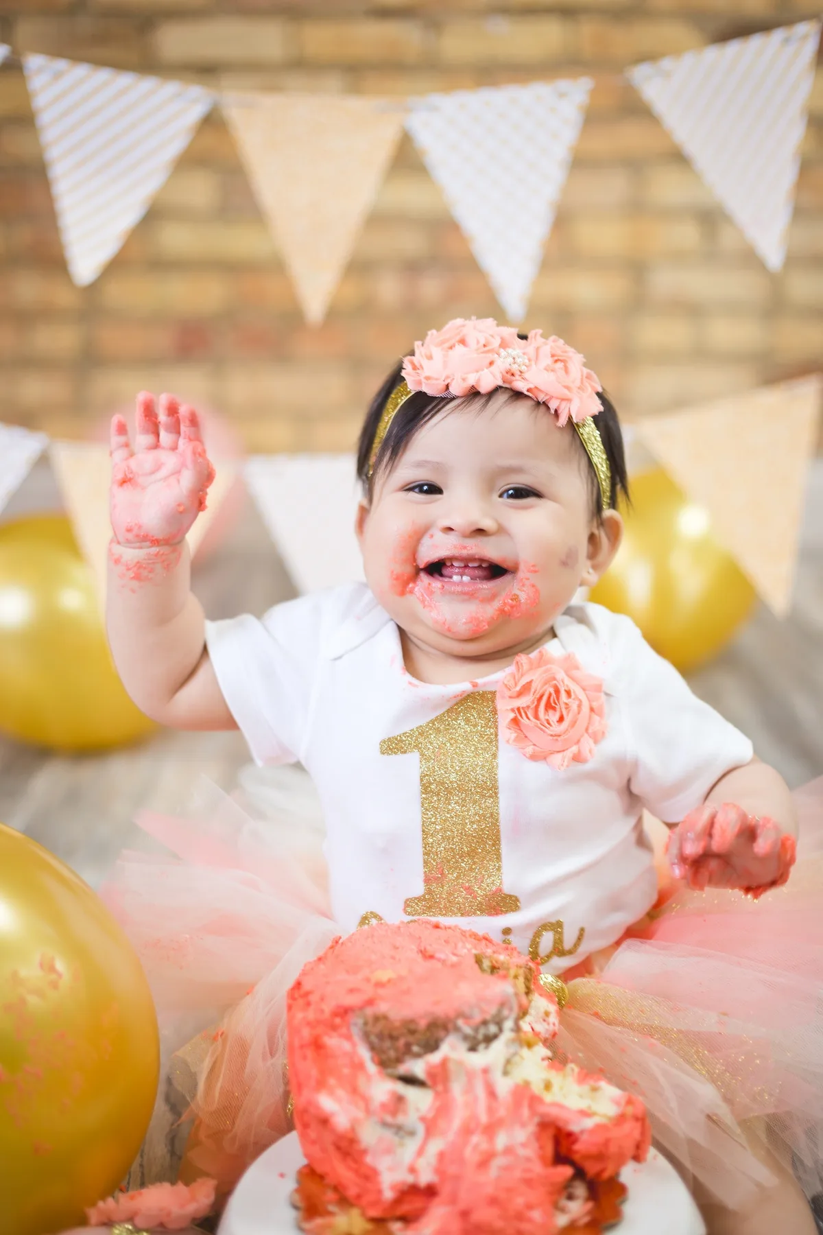 Baby in tutu with cake and banner at home cake smash