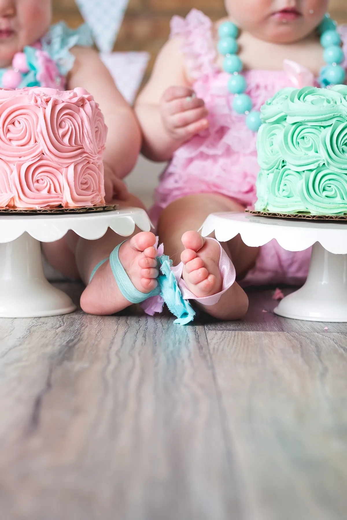 Baby with balloons and cake at home first birthday session